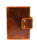 the front of a distressed tan leather a5 journal cover