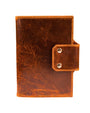 the front of a distressed tan leather a5 journal cover