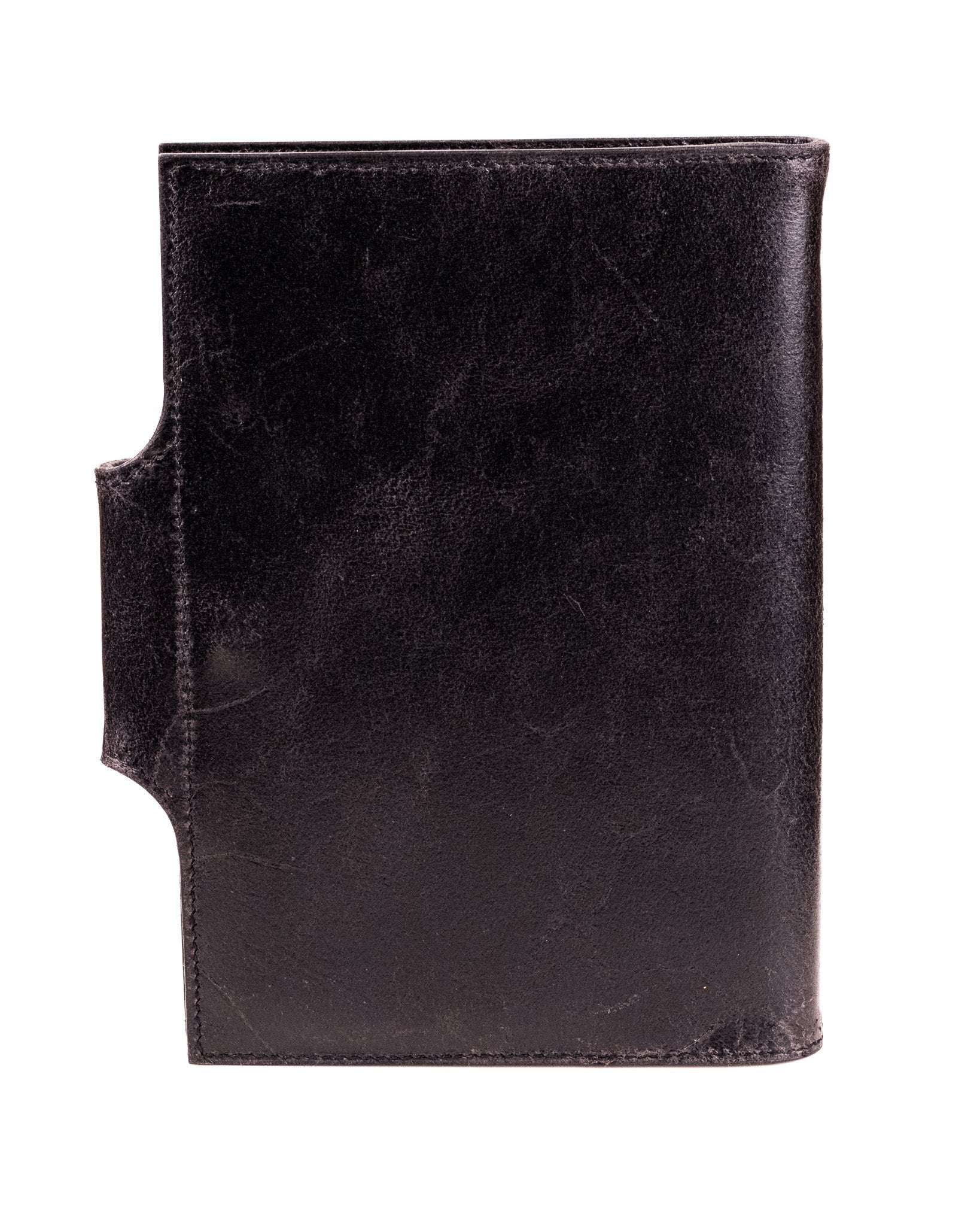 the back of a distressed black leather a5 journal cover