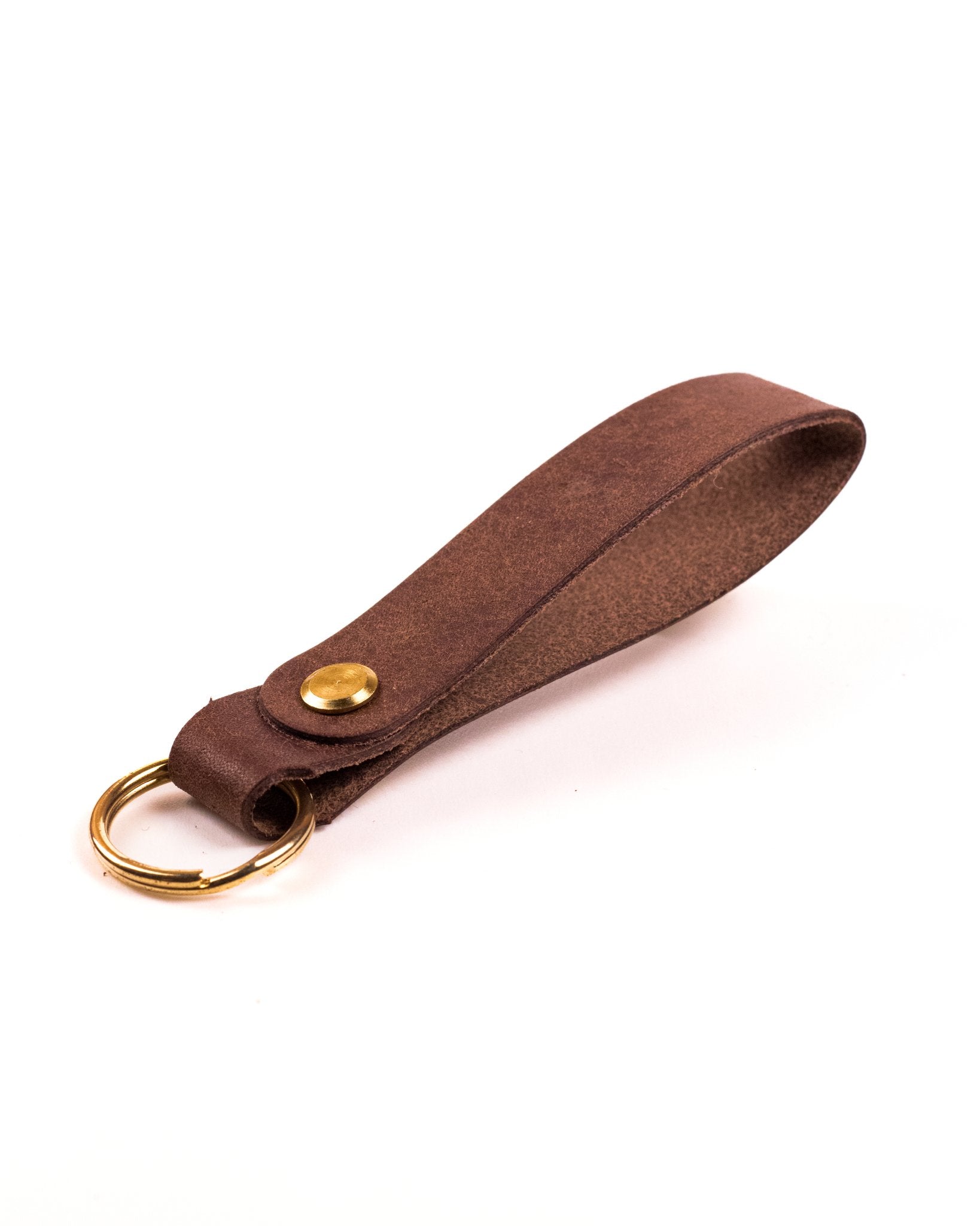 brown italian leather keyring with brass hardware on a white background