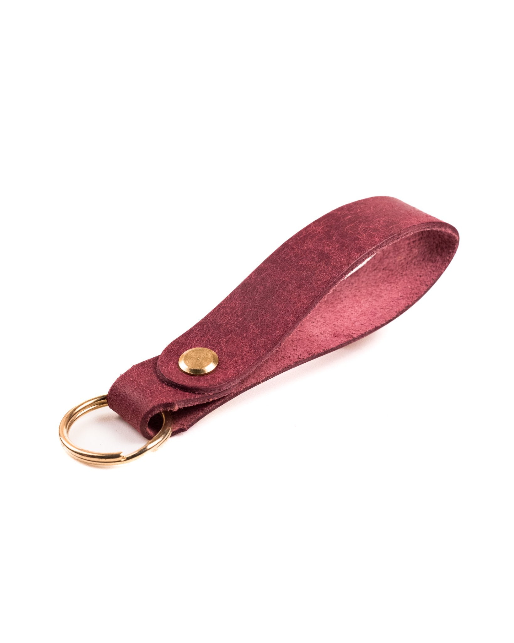 burgundy italian leather keyring with brass hardware on a white background