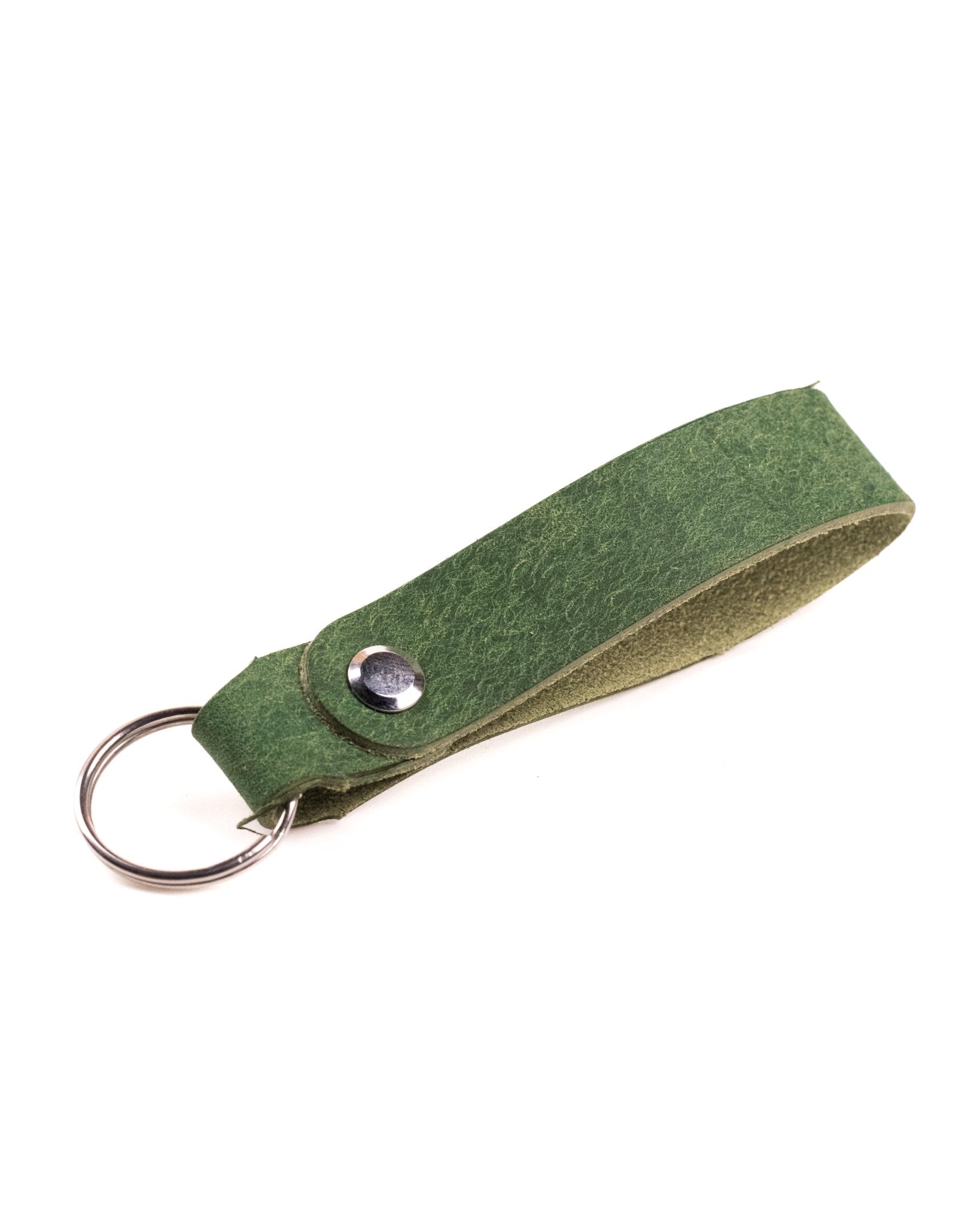 green italian leather keyring with silver hardware on a white background