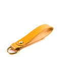 natural glazed italian leather keyring with brass hardware on a white background