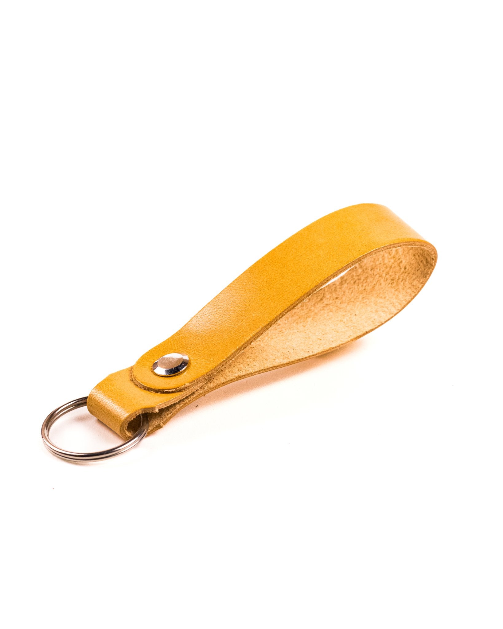 natural glazed italian leather keyring with silver hardware on a white background