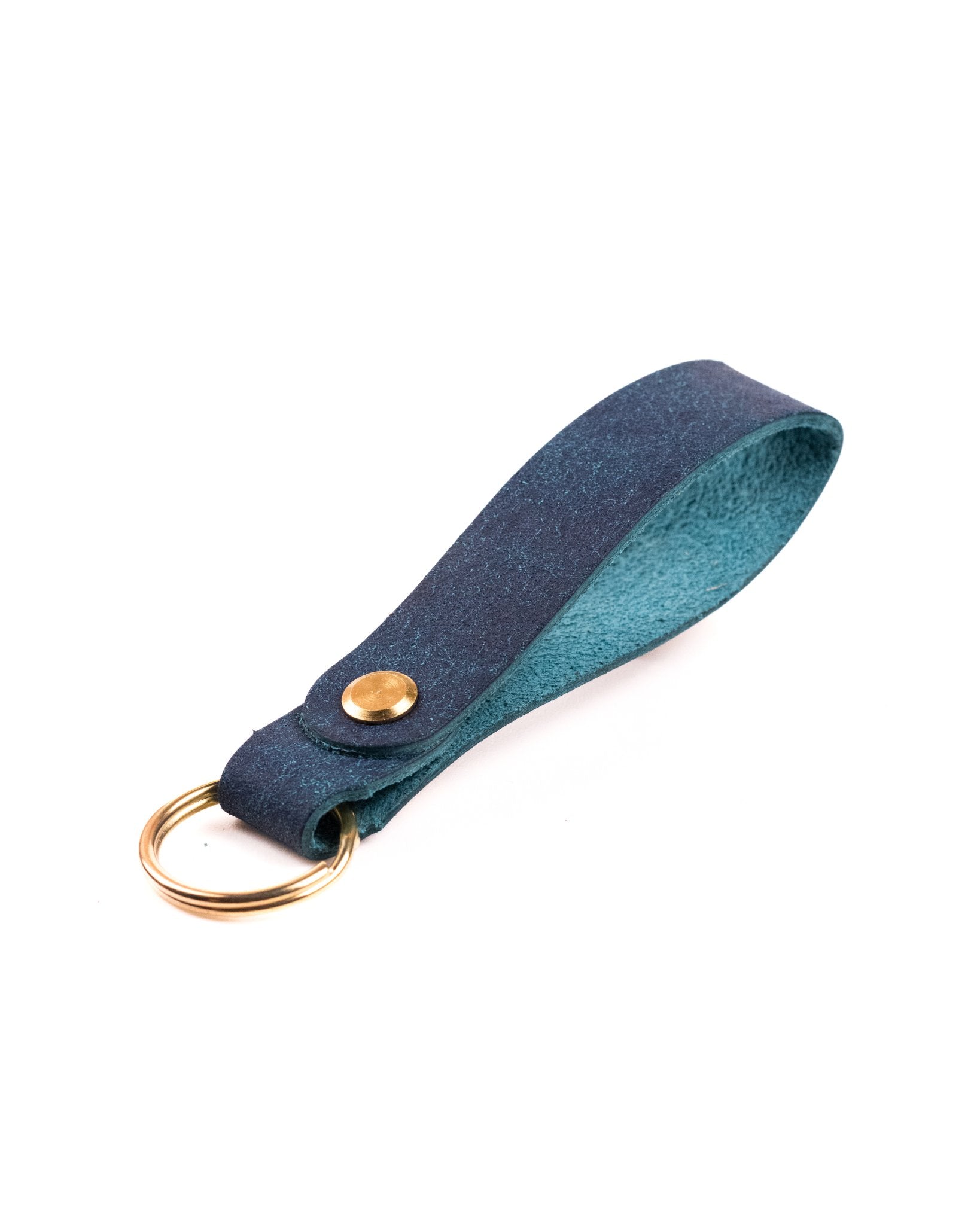 navy italian leather keyring with brass hardware on a white background