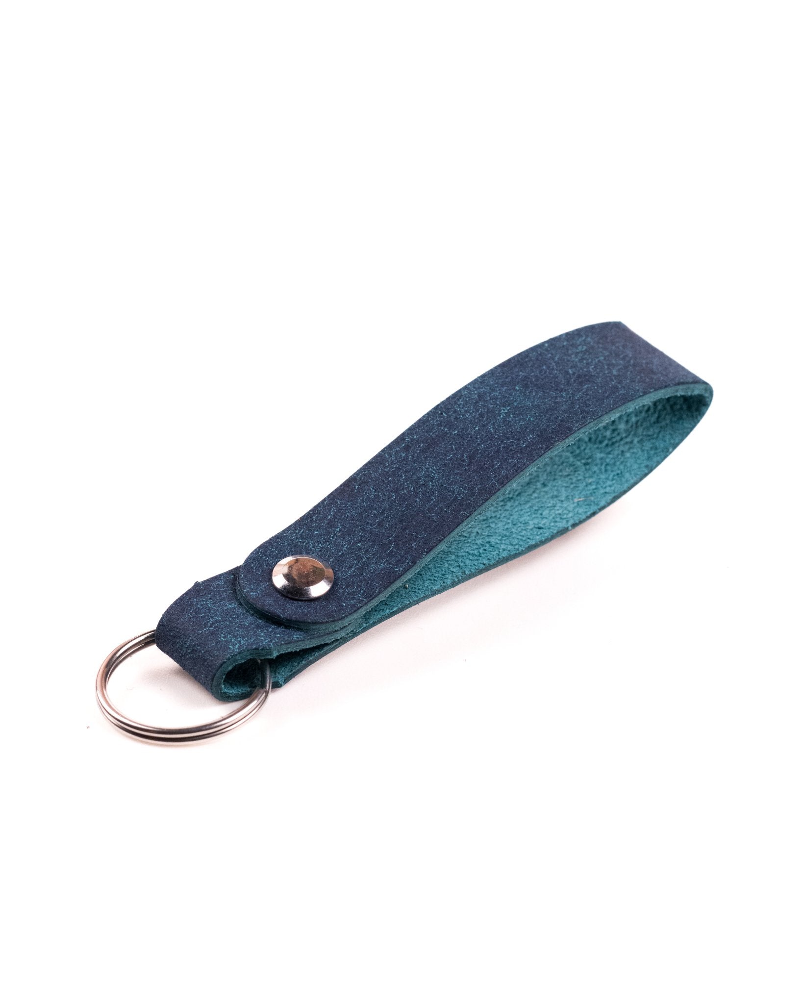 navy italian leather keyring with silver hardware on a white background