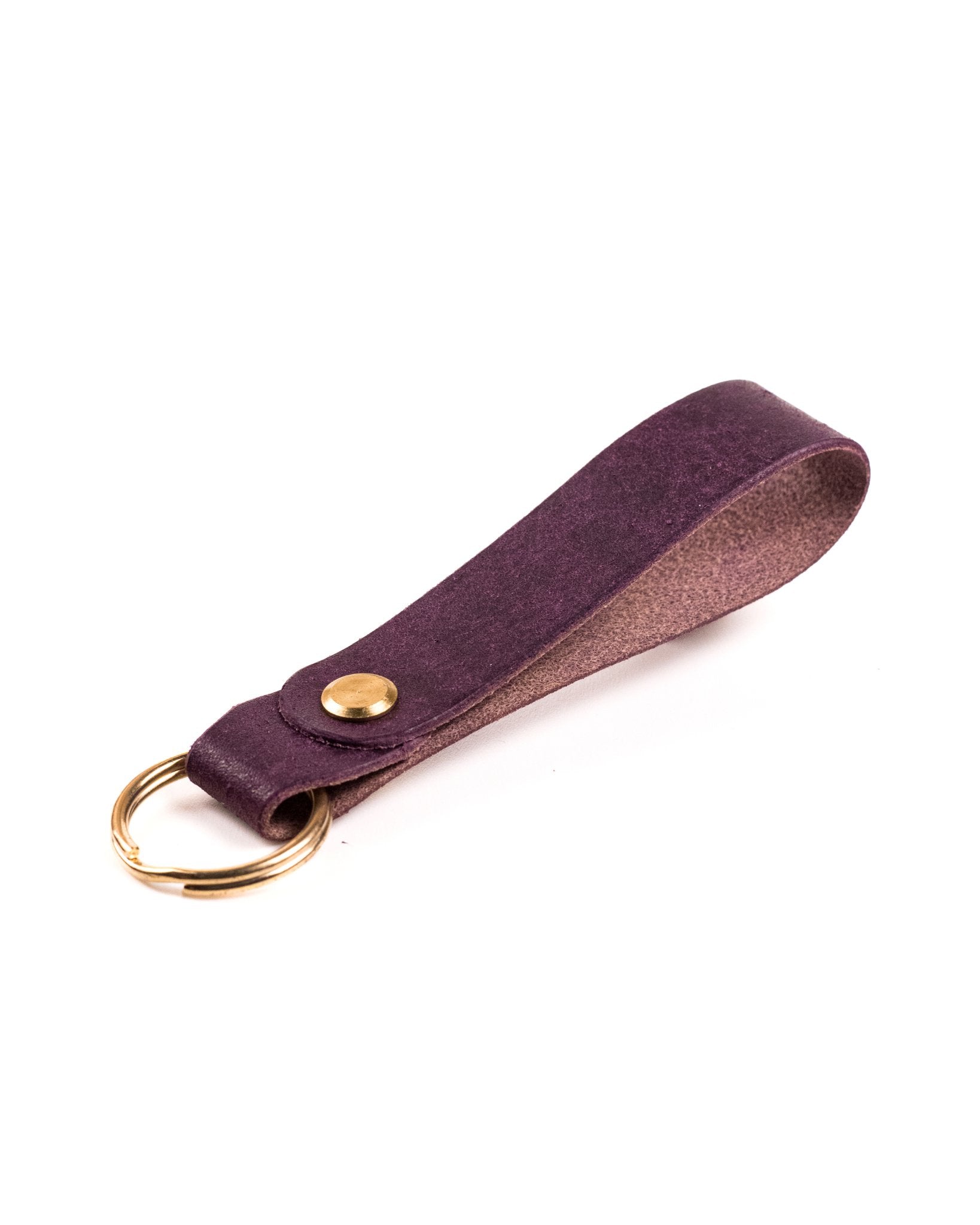 purple italian leather keyring with brass hardware on a white background