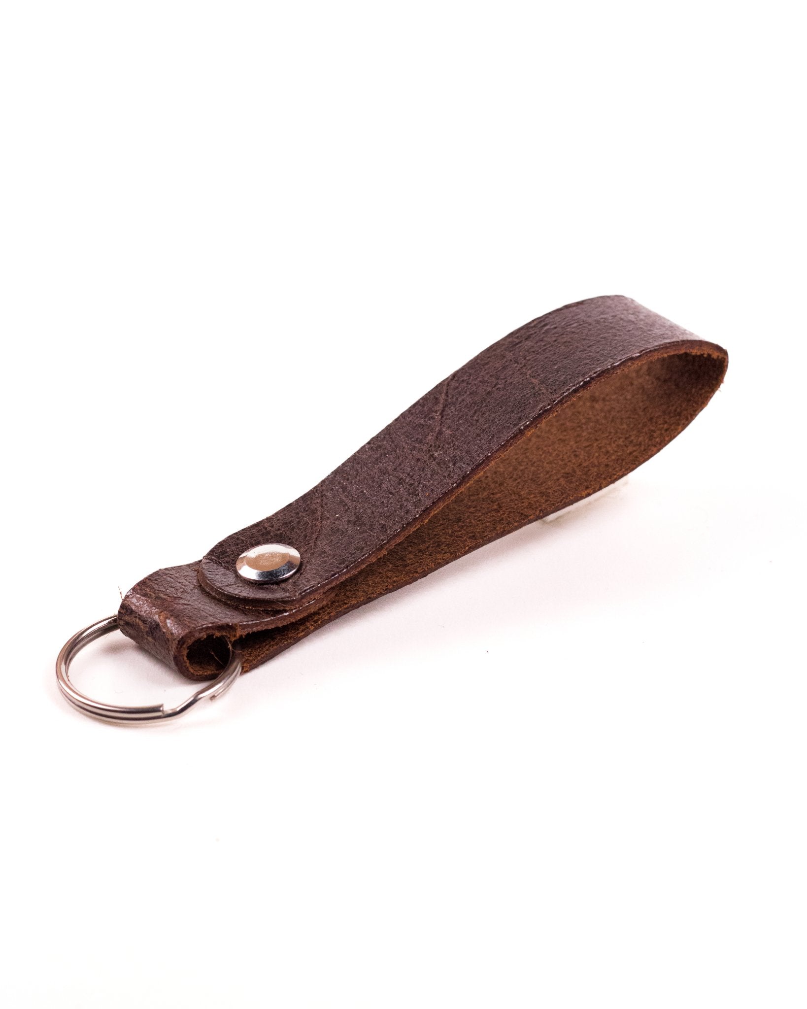 Brown Distressed leather keyring with silver hardware on a white background