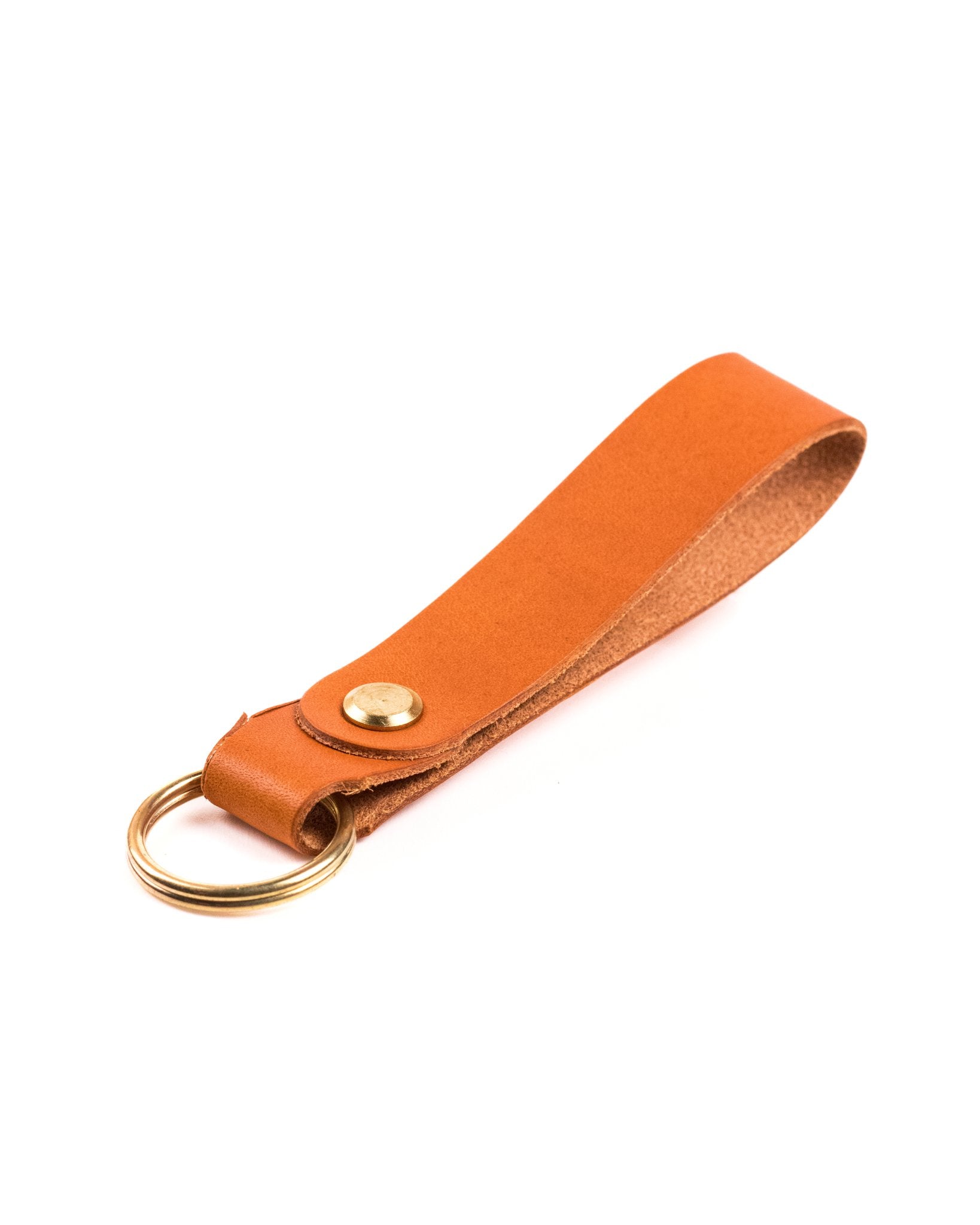 tan italian leather keyring with brass hardware on a white background