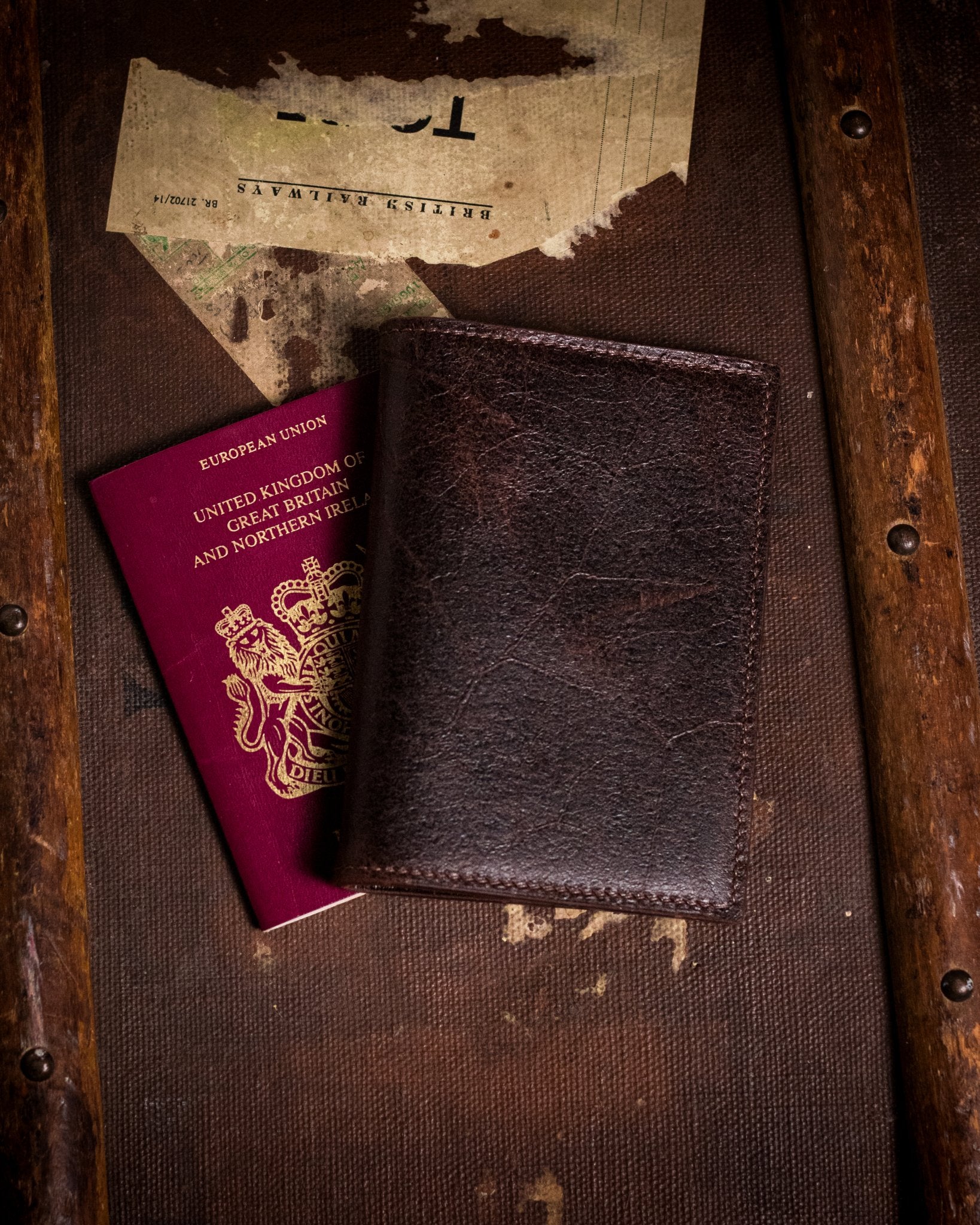 closed distressed brown passport cover with british passport