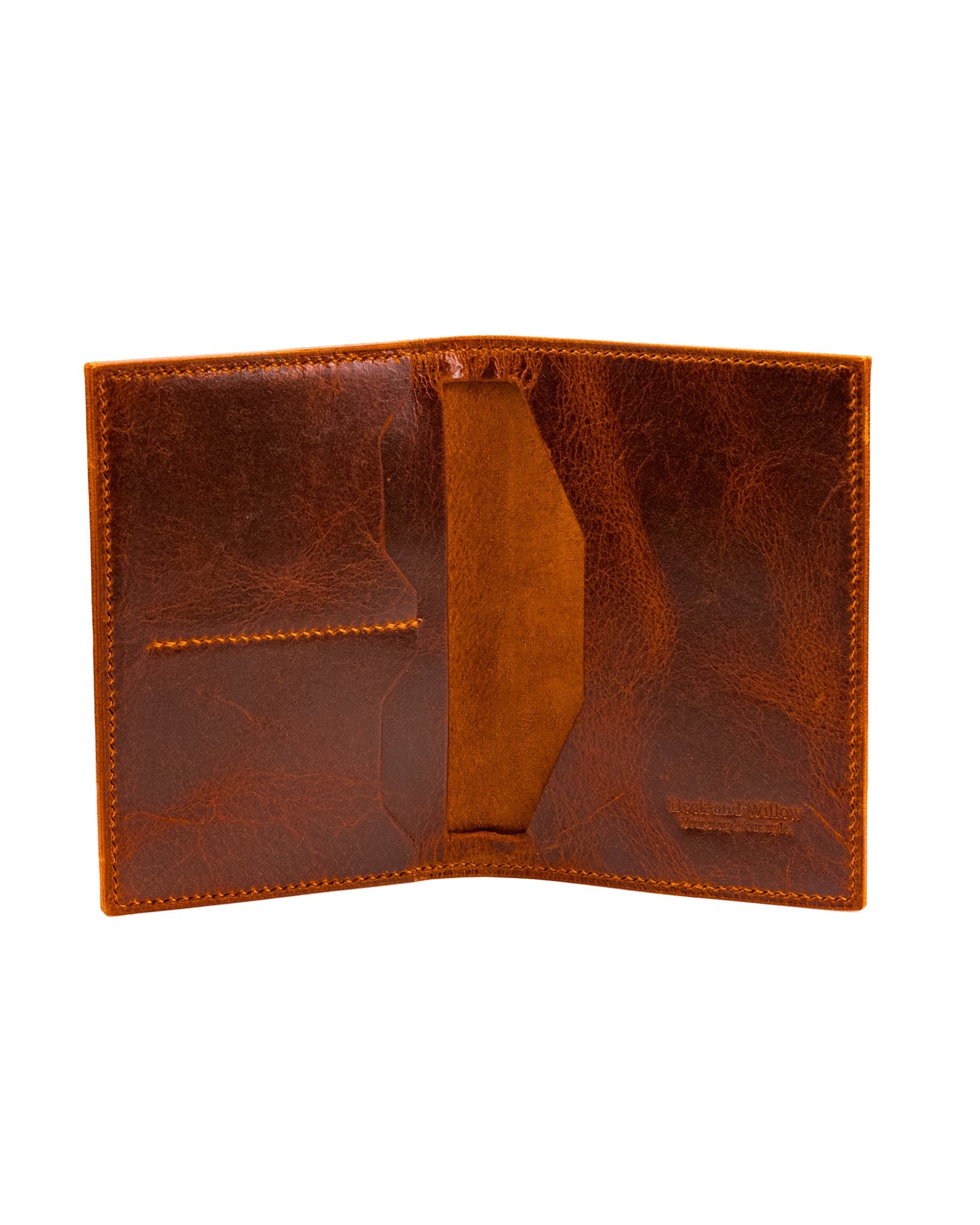 distressed tan leather passport cover on a white background