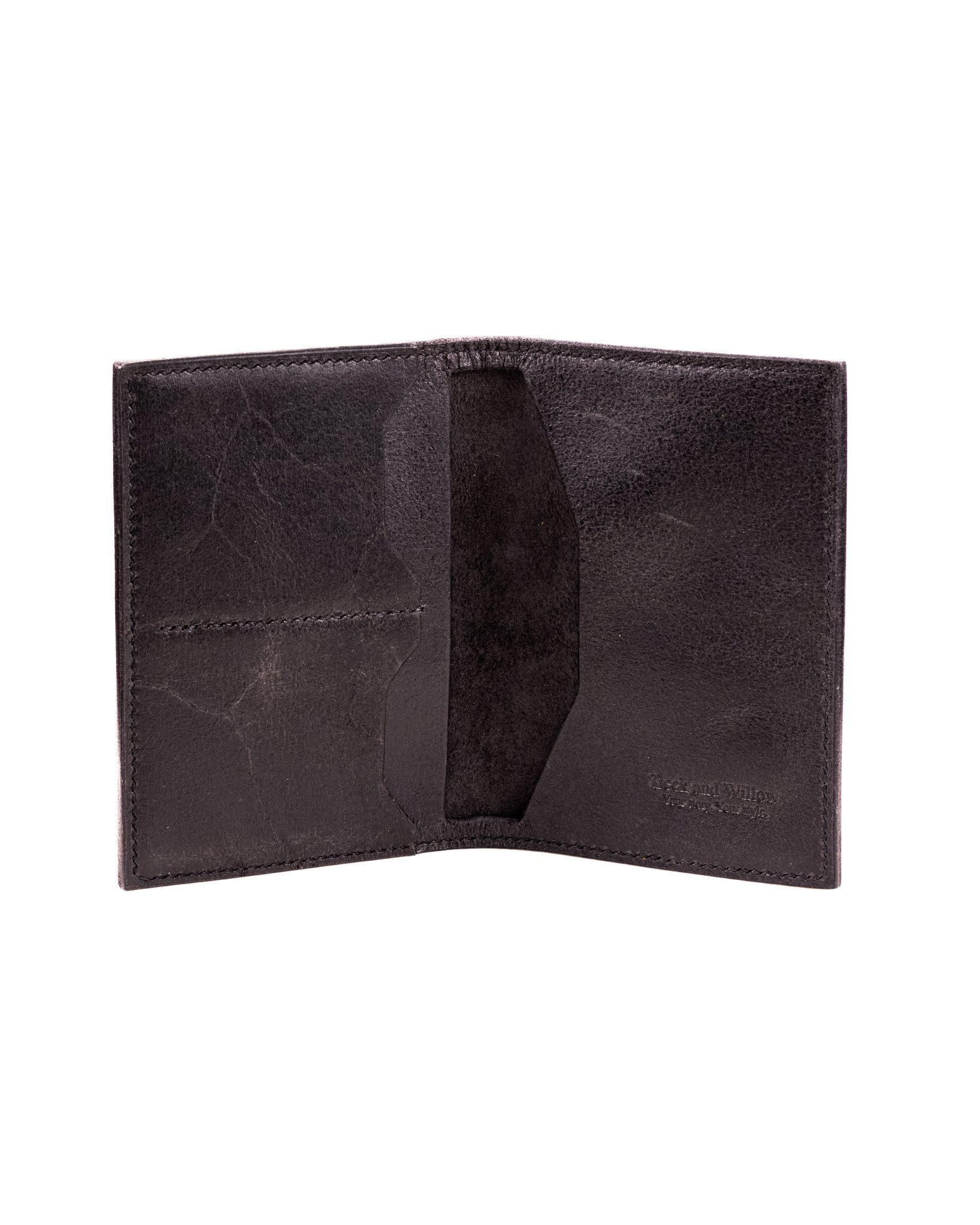 distressed black leather passport cover on a white background