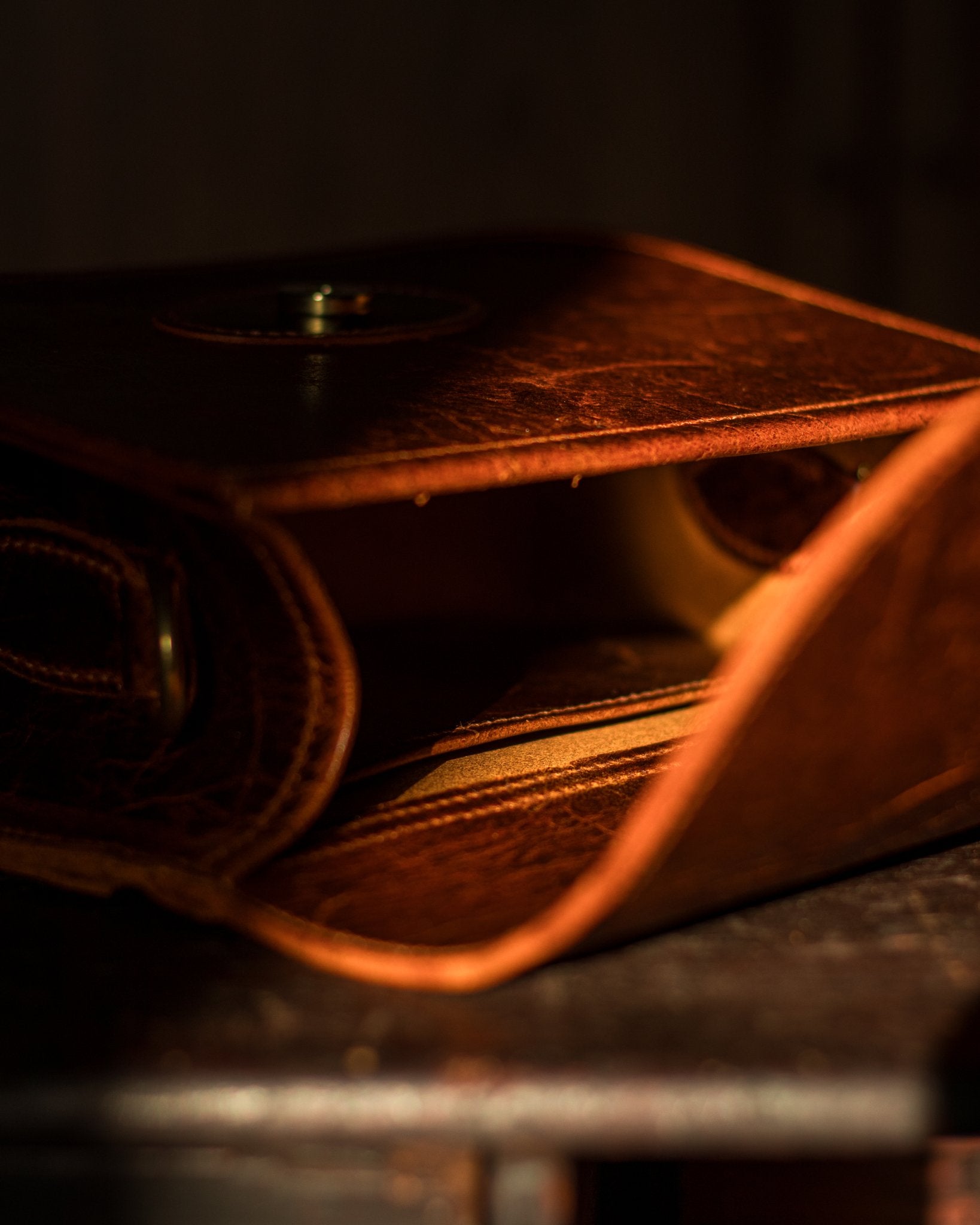 picture of the inside of a bag with a shadow and ray of sun cutting across the screen