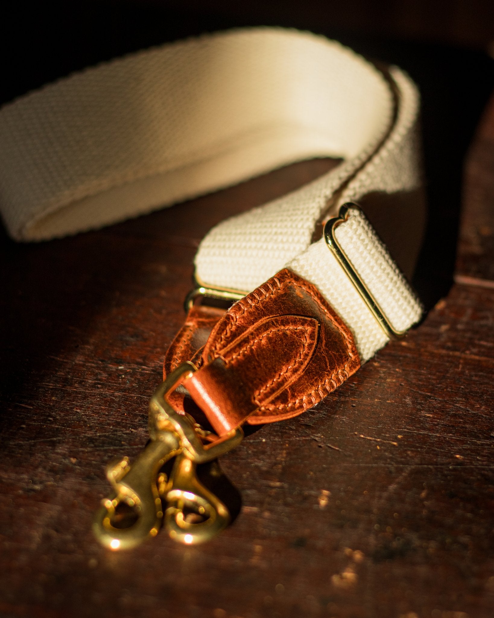cotton, leather and brass strap for a leather crossbody bag