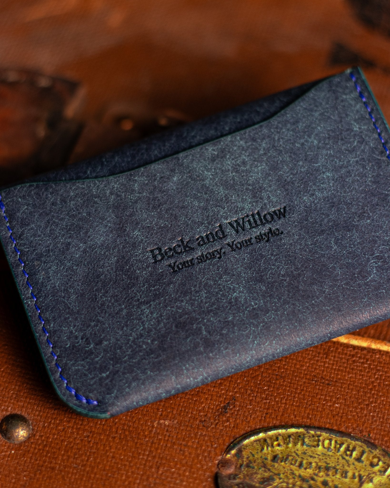 Close Up shot of Brand Logo on a leather card holder in italian blue