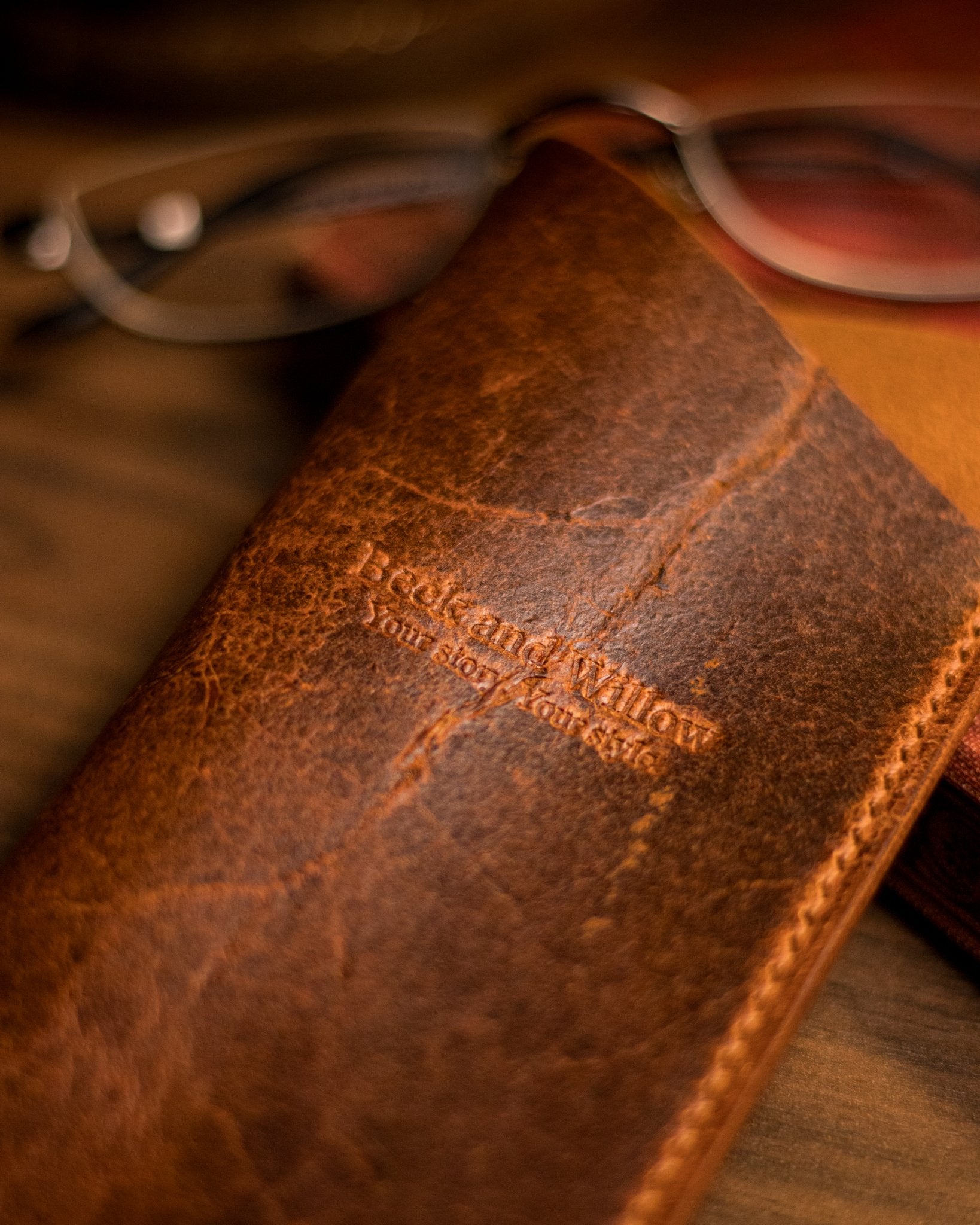 Close up shot of brand logo on a leather glasses sleeve