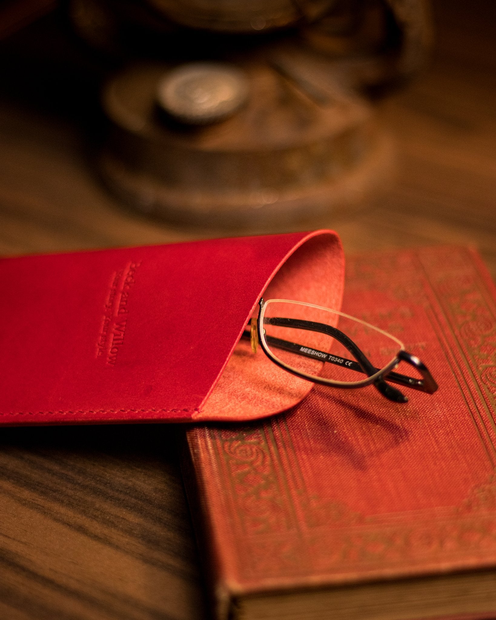photo of glasses peaking out of a red italian glasses case