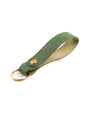 green italian leather keyring with brass hardware on a white background