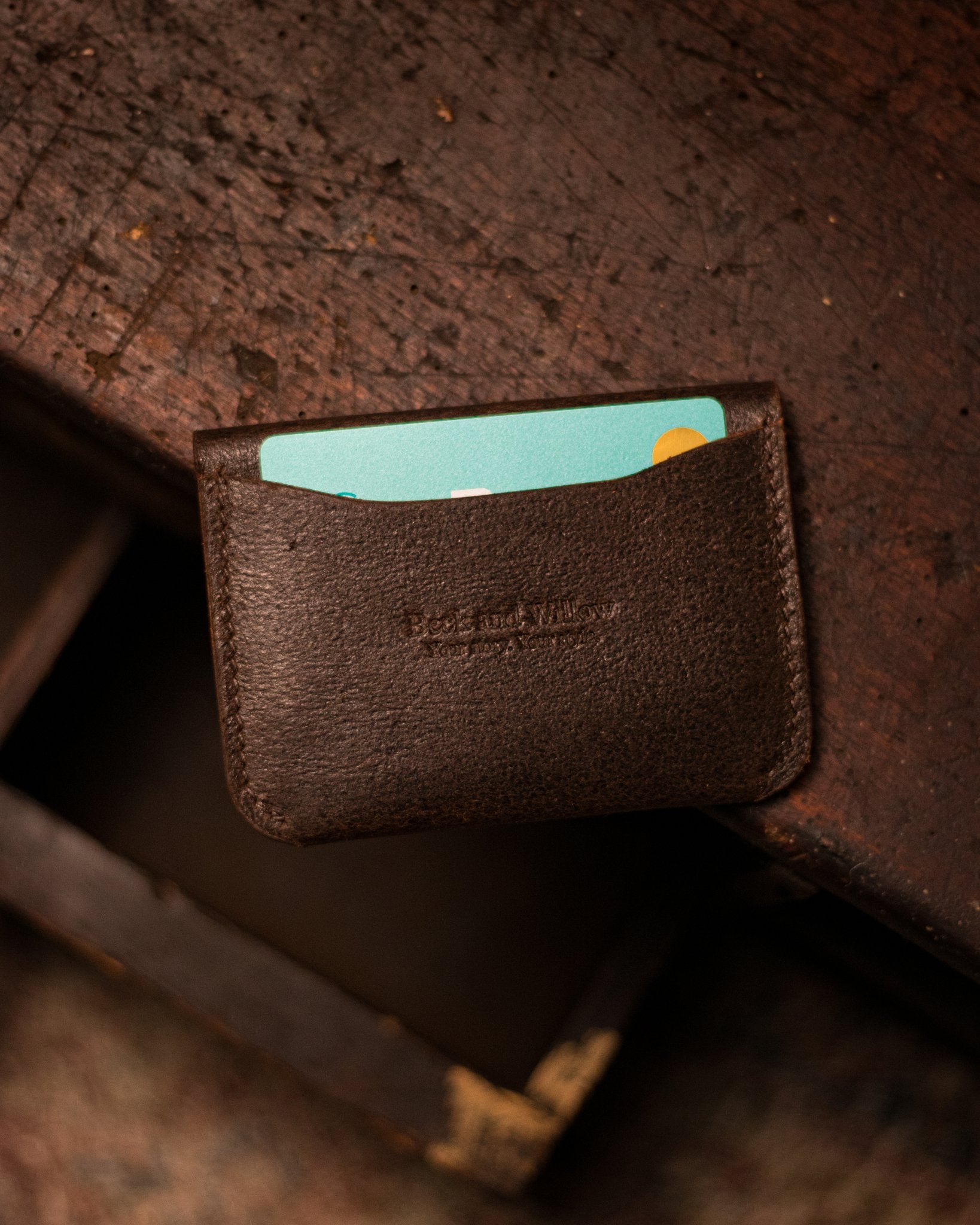 Distressed Brown Cardholder With Bank Card
