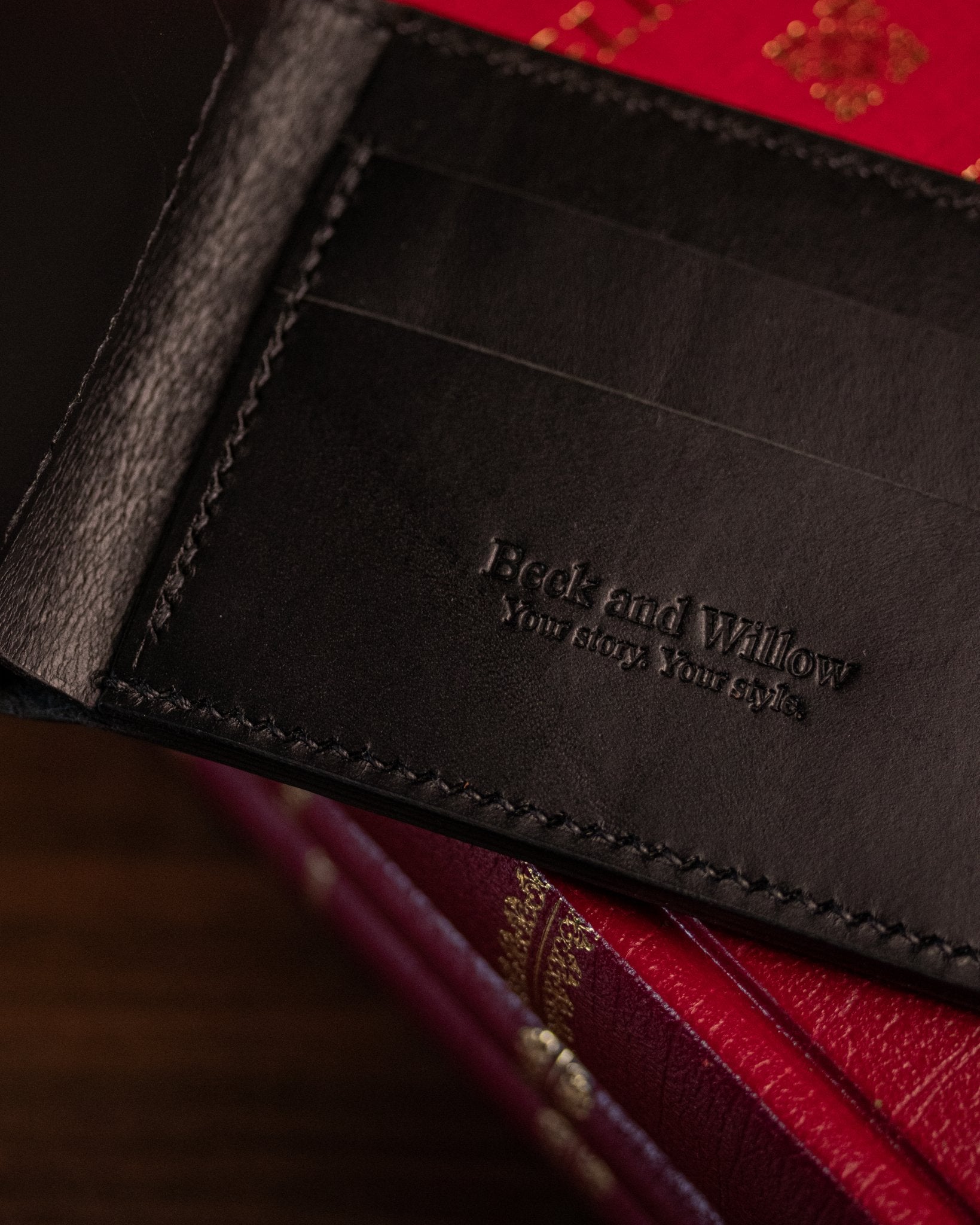 close up shot of brand logo on italian black leather wallet