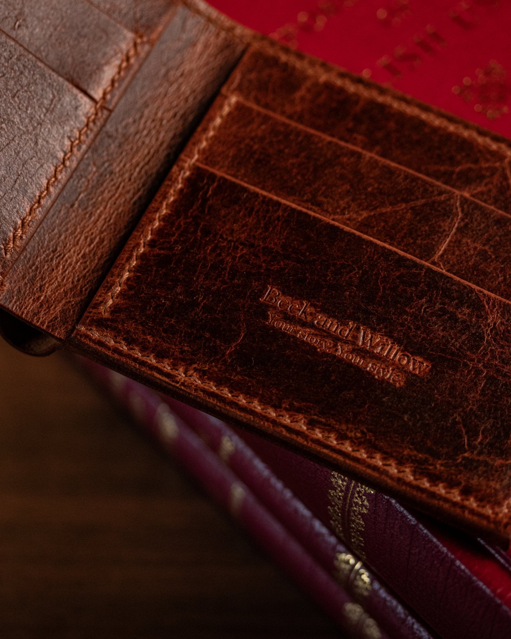close up detail shot of brand logo on a distressed tan wallet