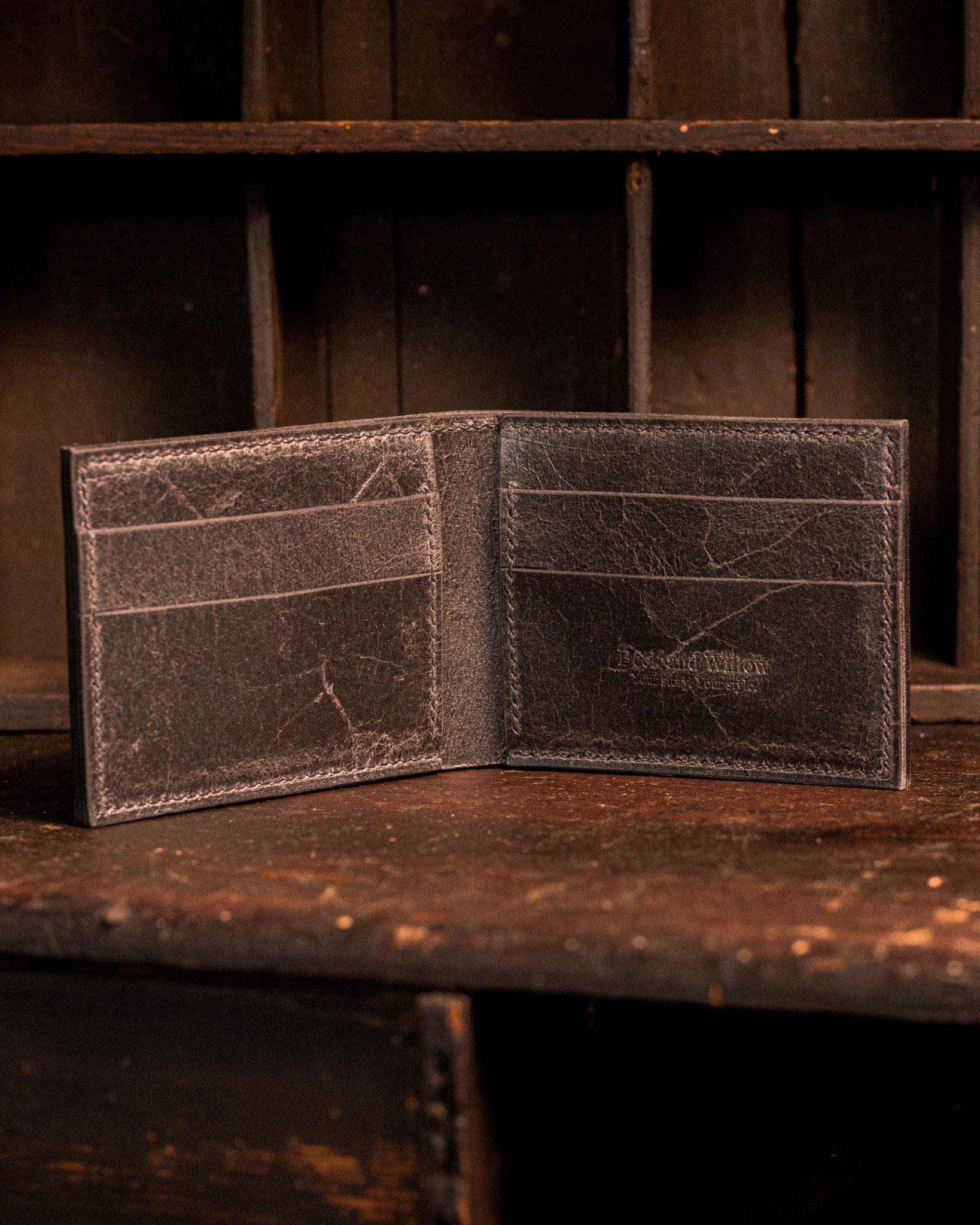 distressed black leather bifold wallet lifestyle photo