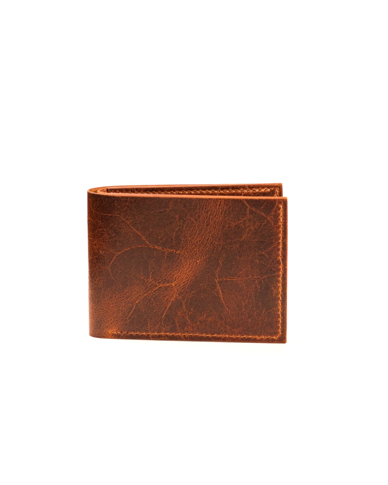 closed distressed tan leather wallet on white background
