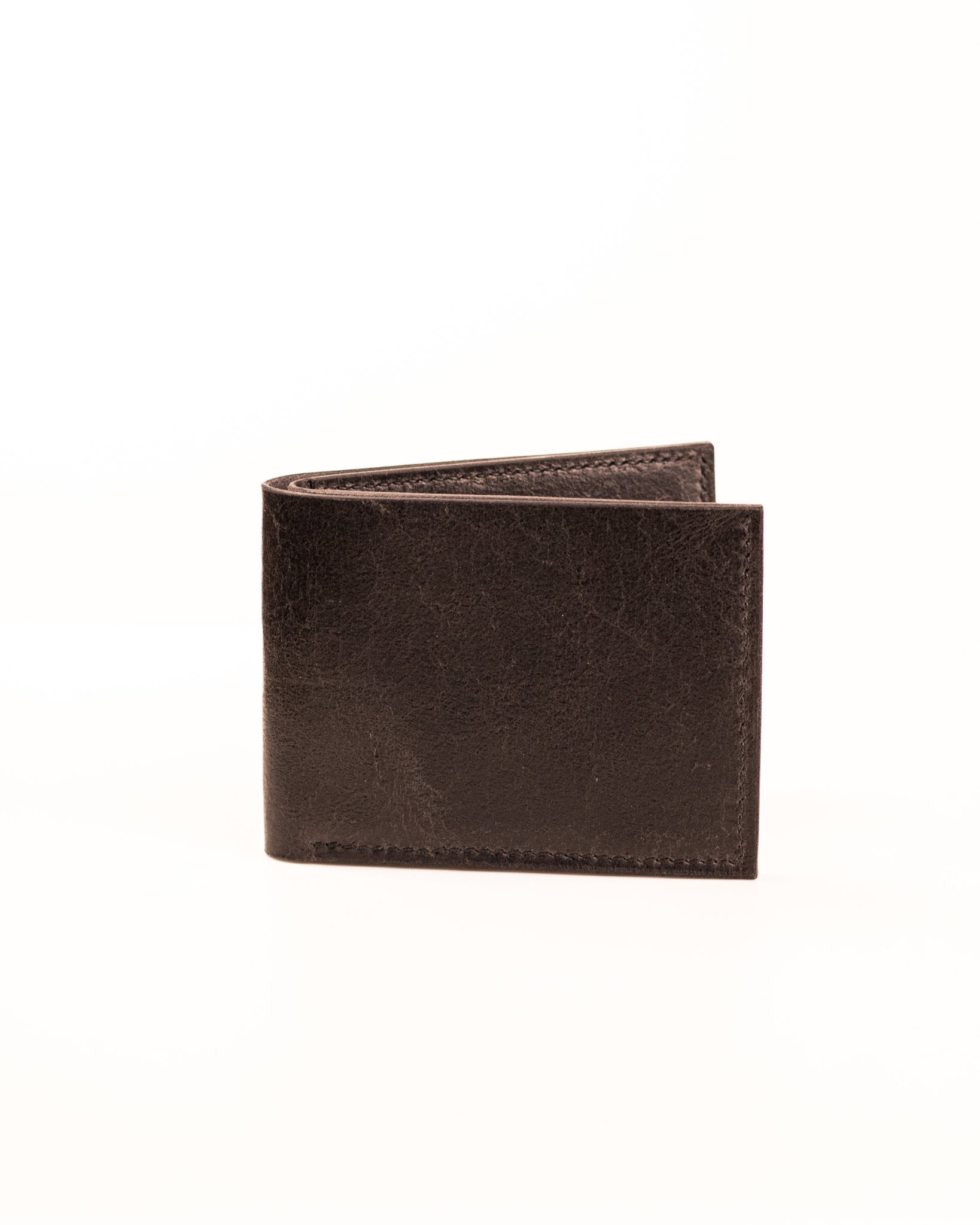 closed distressed black leather wallet on white background