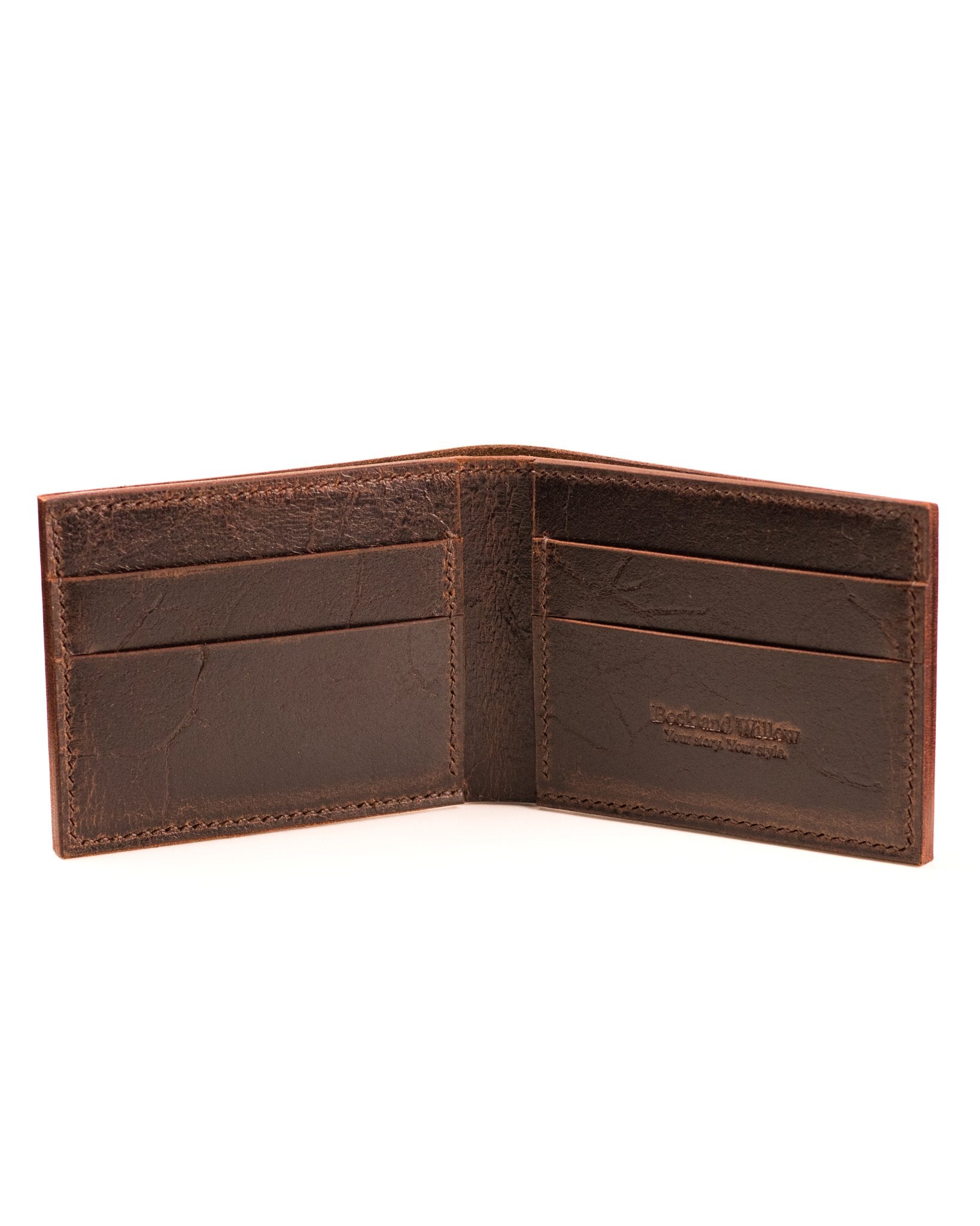 open distressed brown leather wallet on a white background